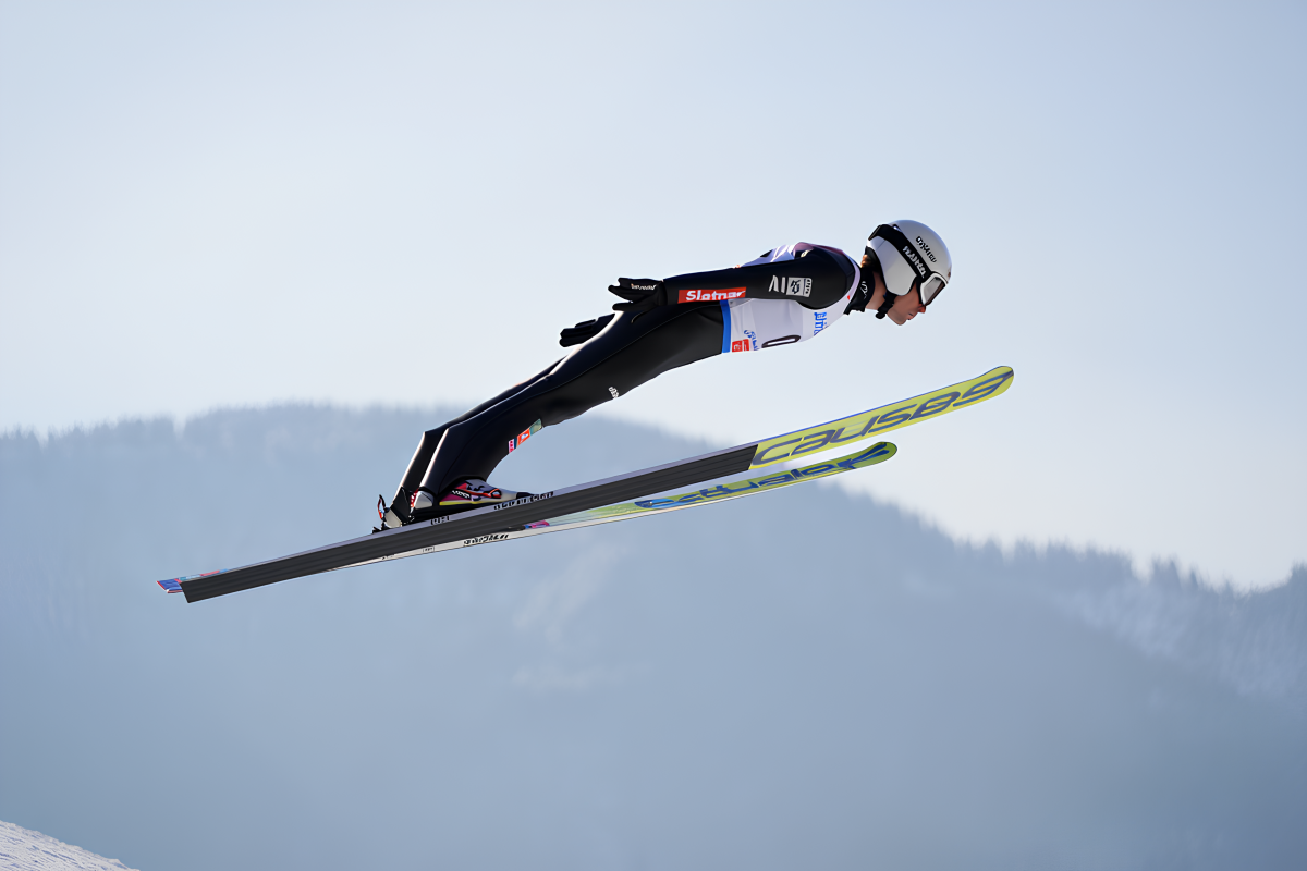A professional ski jumper executes a perfect competition jump