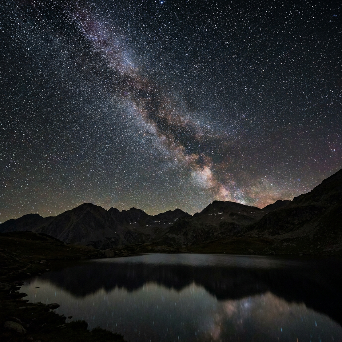 Starry night over mountains covered bilions stars at sky landscape