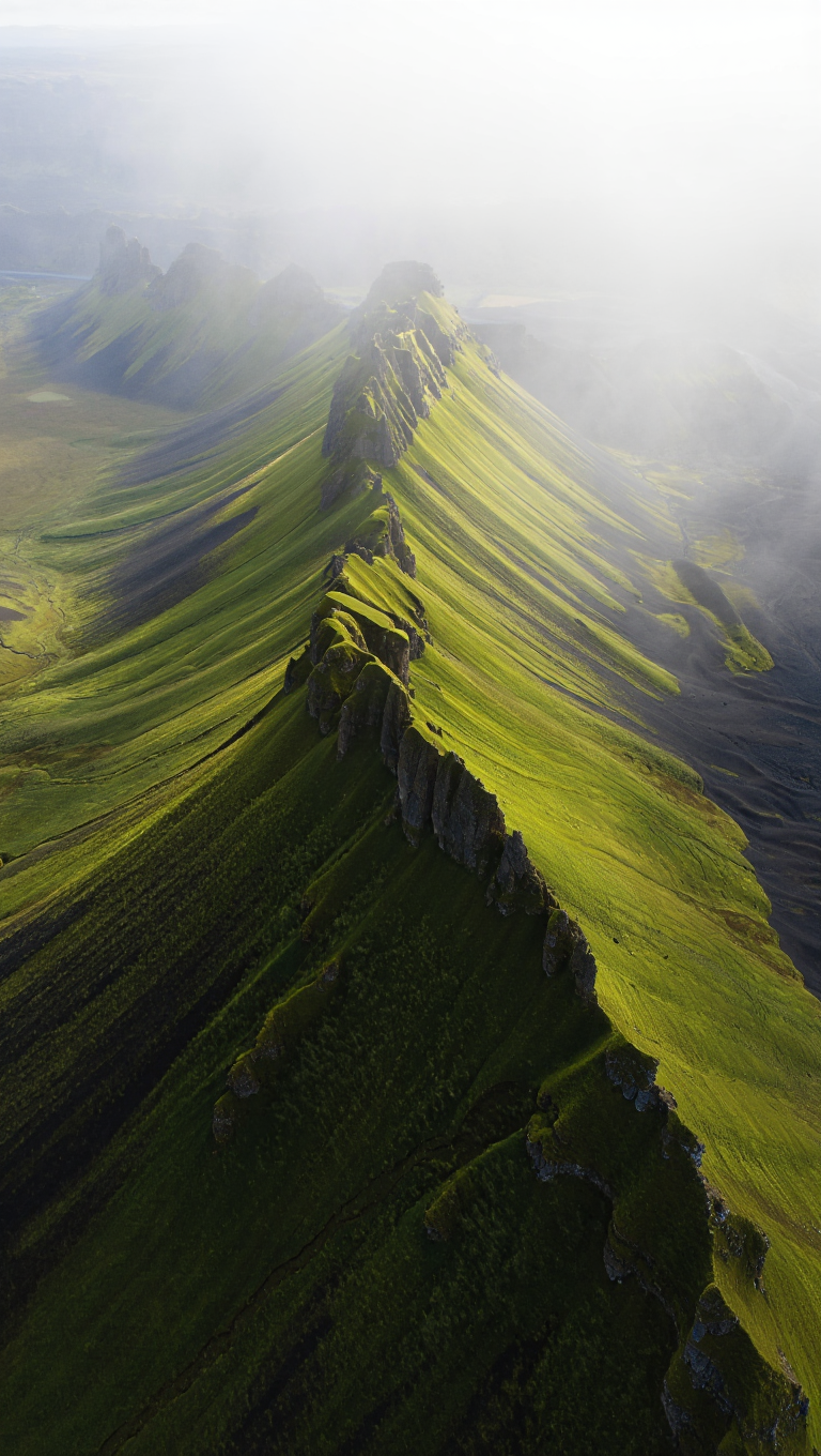 An aerial photography of a dramatic mountain ridge in Iceland