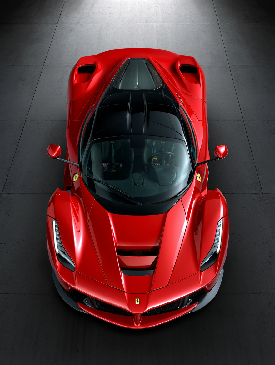 An overhead view of a Ferrari LaFerrari hypercar photographed in an industrial indoor setting