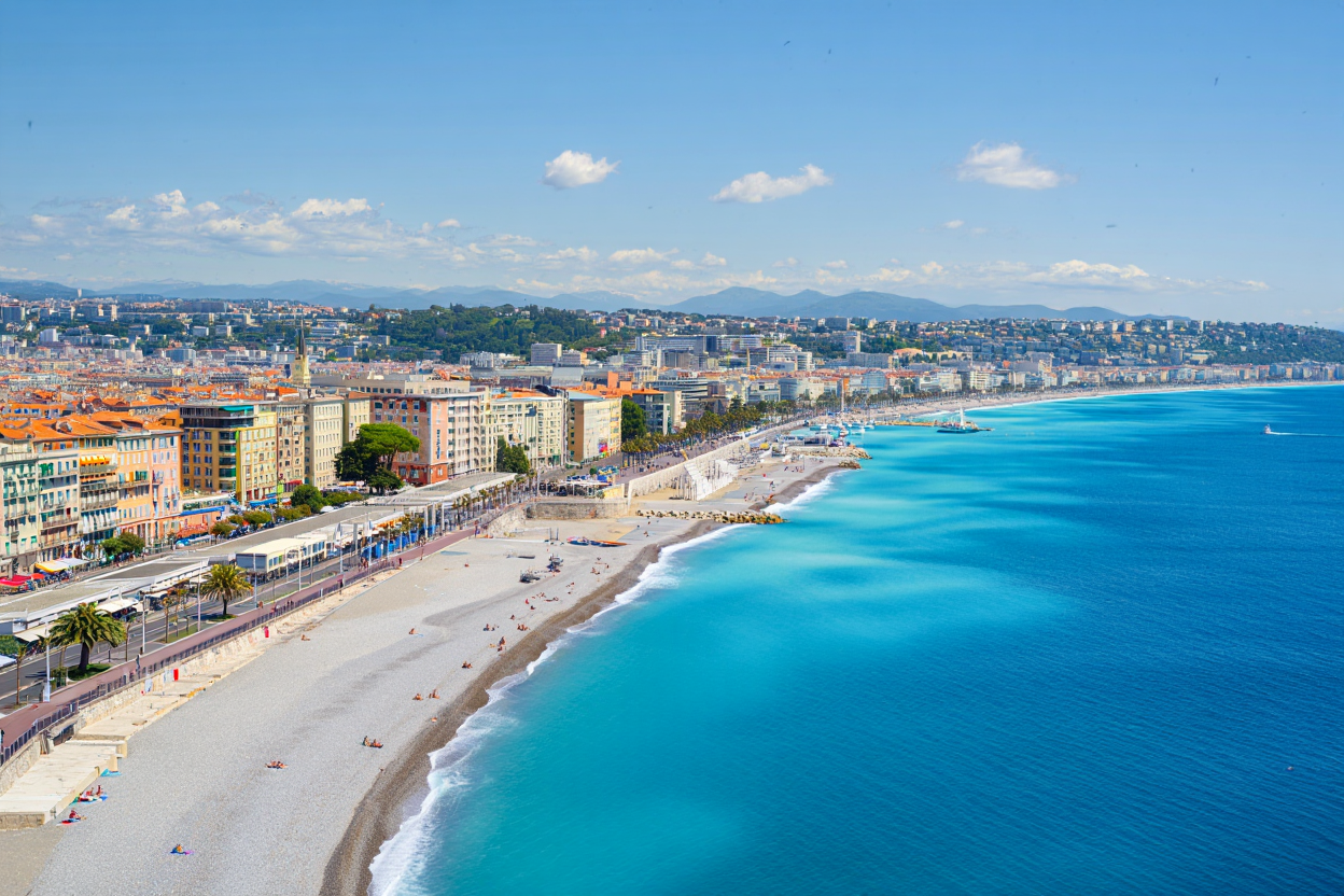 A daytime aerial view of the French city of Nice showing the iconic Promenade des Anglais seaside walkway along the Baie des Anges