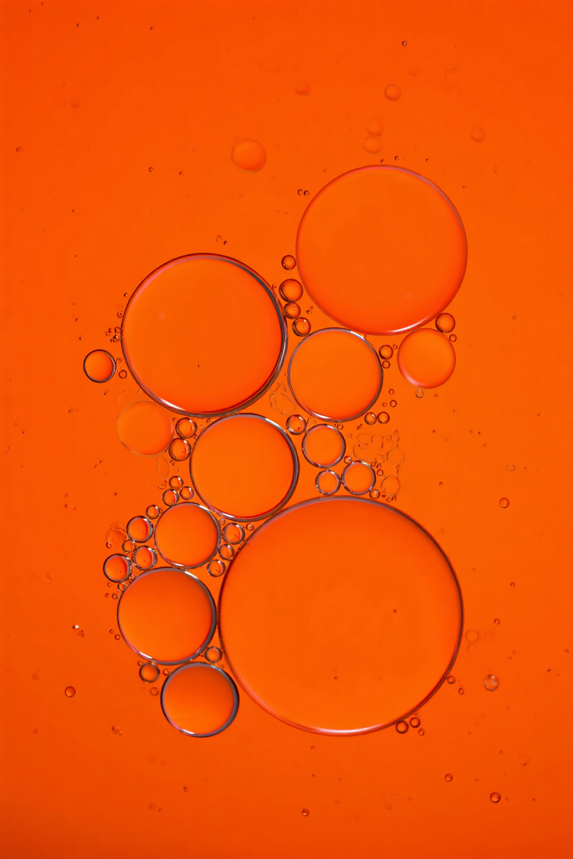 Hot of orange oil bubbles suspended in water